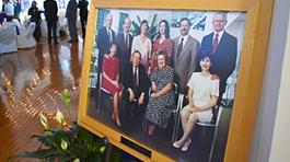 McMaster family in wooden frame at entrance of venue