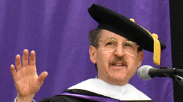 Howard Reich speaking at a Defiance College podium