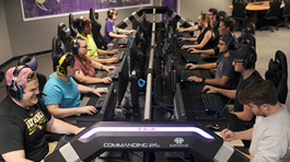 Students sitting at computers in the eSports arena