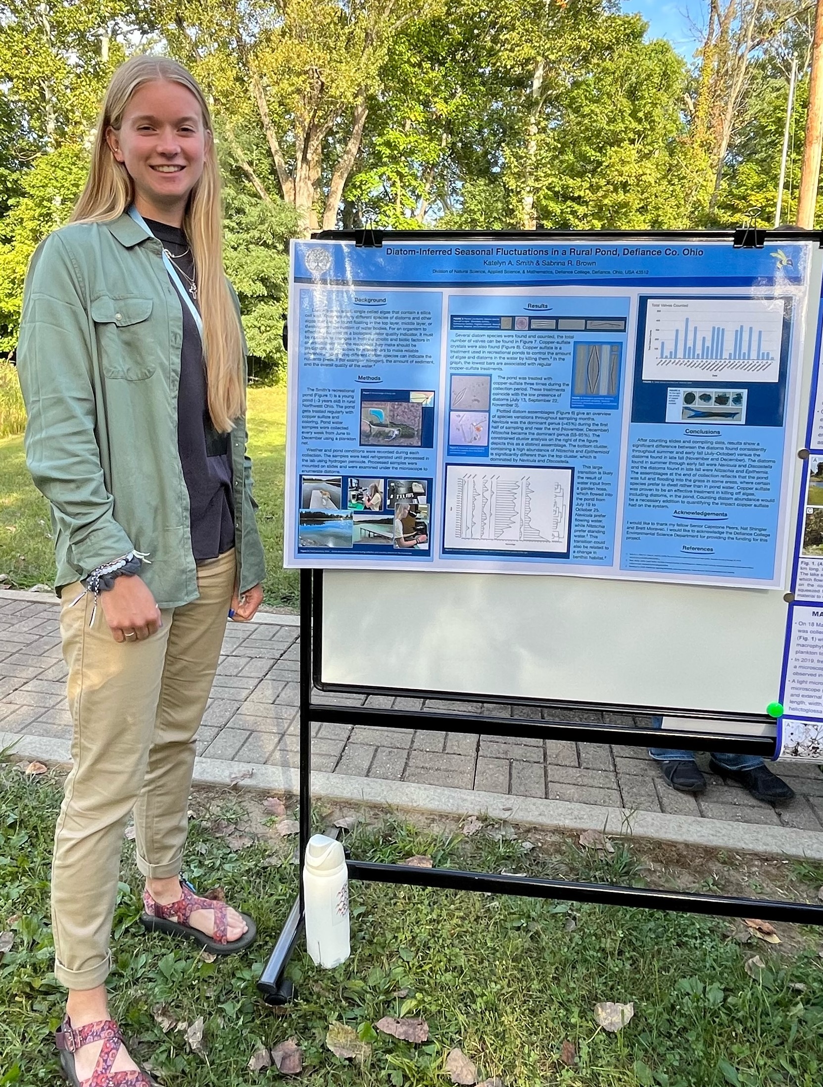 Female presenting research on fluctuations in local pond