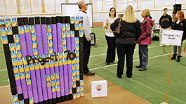 Project 701 logo constructed in stacked cans