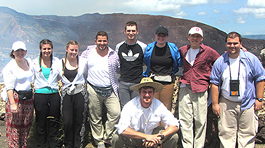 nine students in front of scenic mountain view in Nicaragua 