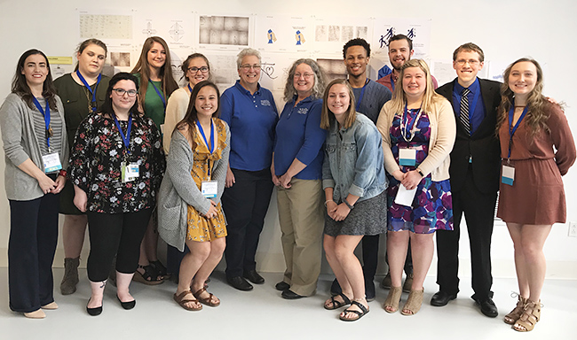 Pictured in the group photo from left to right, starting in the back, are: Assistant Professor of Design Beverly Fanning-Simmons, students Jordan Williams, Sidney Faine, Shelby Stamm; Kelli Burkhardt, founder and executive director of Together We Can Make A Difference Initiatives, Carol Castello from Together We Can Make A Difference Initiatives, students Keith McClure, Logan Peterson, Jared Feffer, Taylor Wells, Chyanne Cameron, Katherine Settich, Katarina Wicher, Caroline Klein.