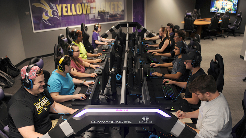students sitting at computers in Defiance College's eSports arena