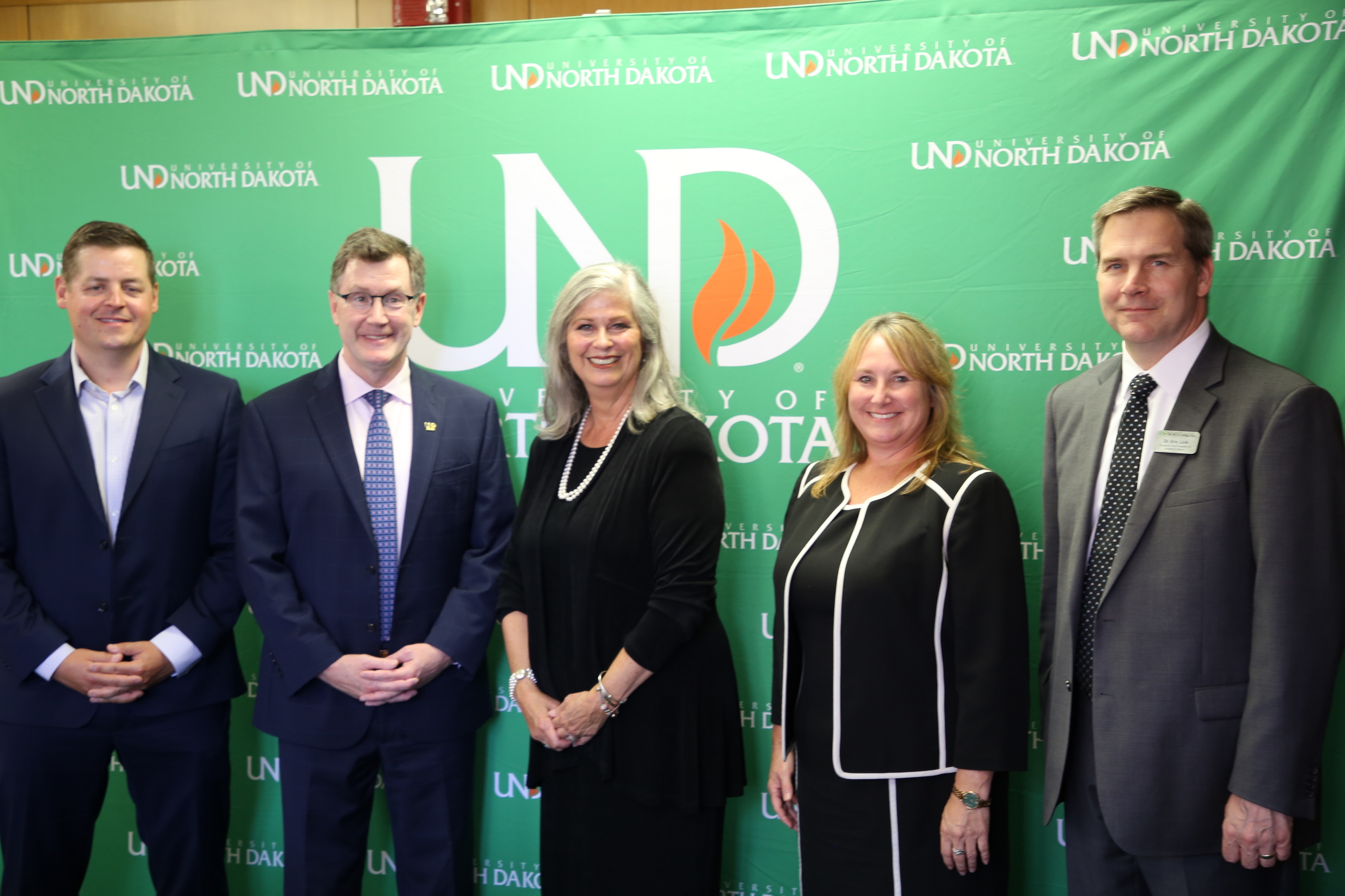 from left, they are Brian Tande, dean, UND College of Engineering & Mines; President Armacost; President Mankey; Agnes Caldwell, academic dean and VP for academic affairs at Defiance; and Eric Link, provost and vice-president for academic affairs at UND