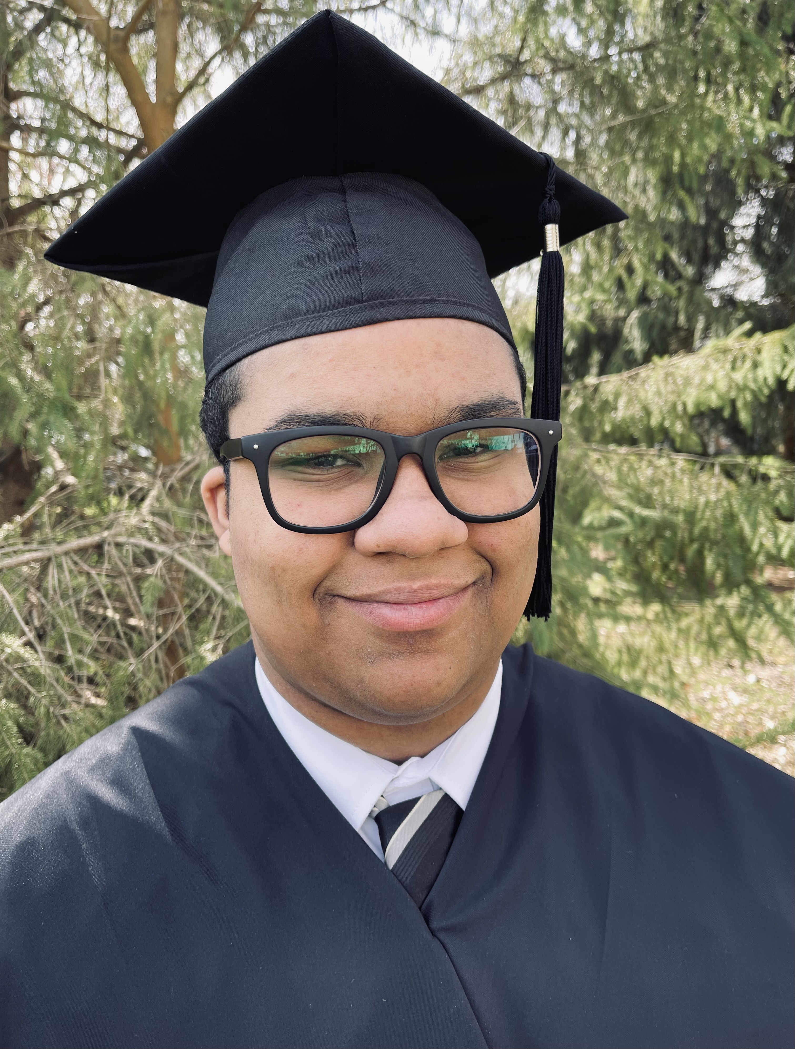 head and shoulder shot of Tyler Taylor in his cap and gown