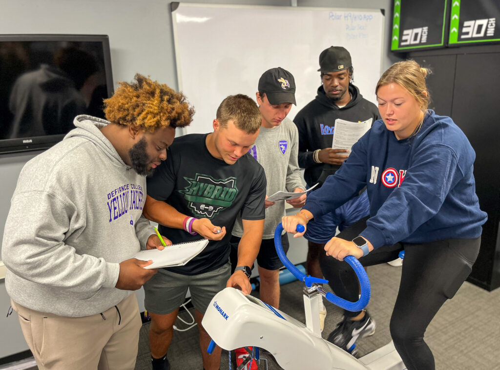 Students conducting an experiment in an Exercise Science class.
